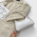 Cécile. - Lesklá kožená taška